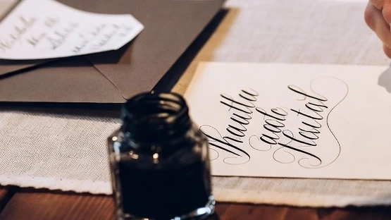 Live calligrapher personalisation during a wedding celebration in Singapore
