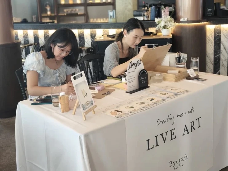 live guest portraits where personalised artworks are painted on-site 
