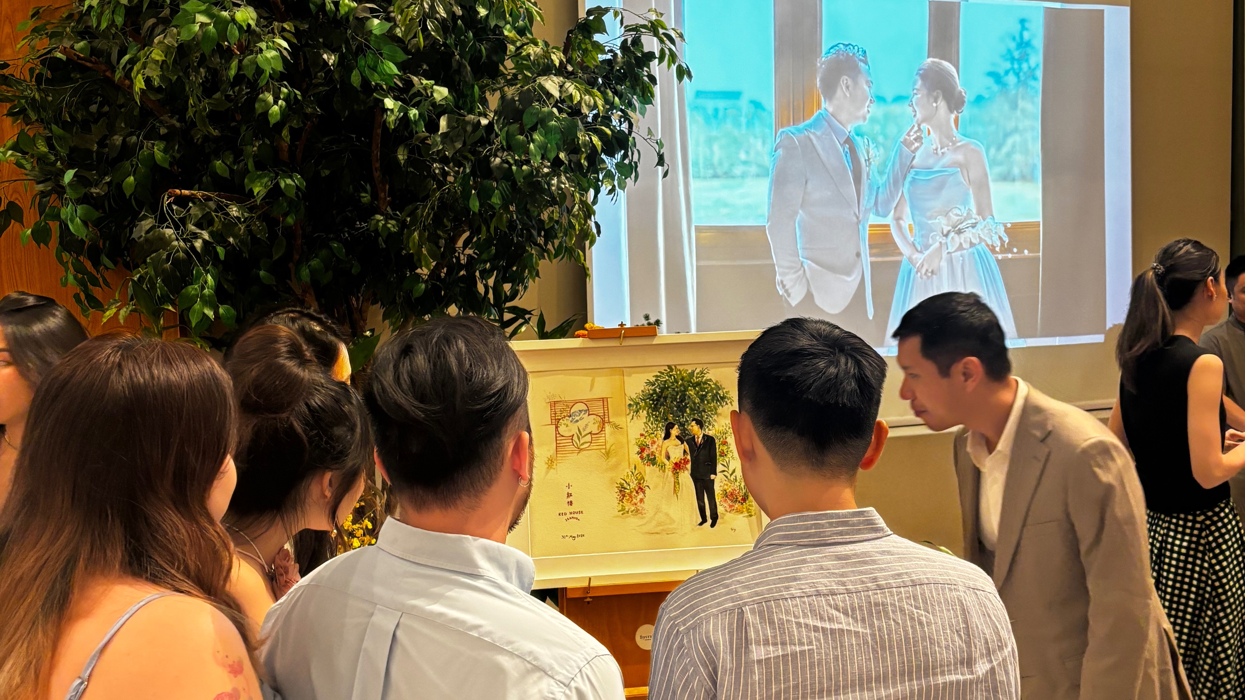 Guest hovering and admiring live couple painting